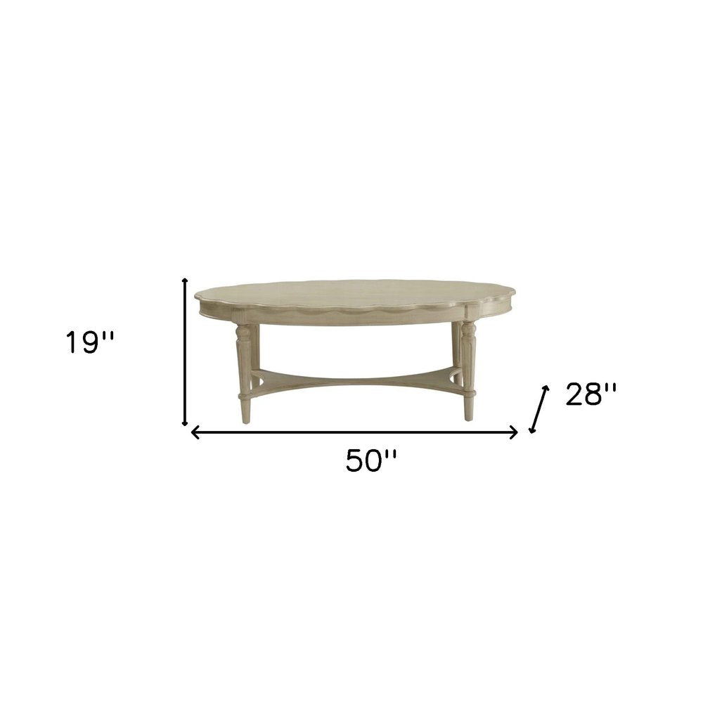 Antiqued White Solid Wood Oval Distressed Coffee Table - 50-inch