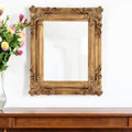 Antiqued Gold Ornate Scroll Framed Accent Mirror - 23-inch