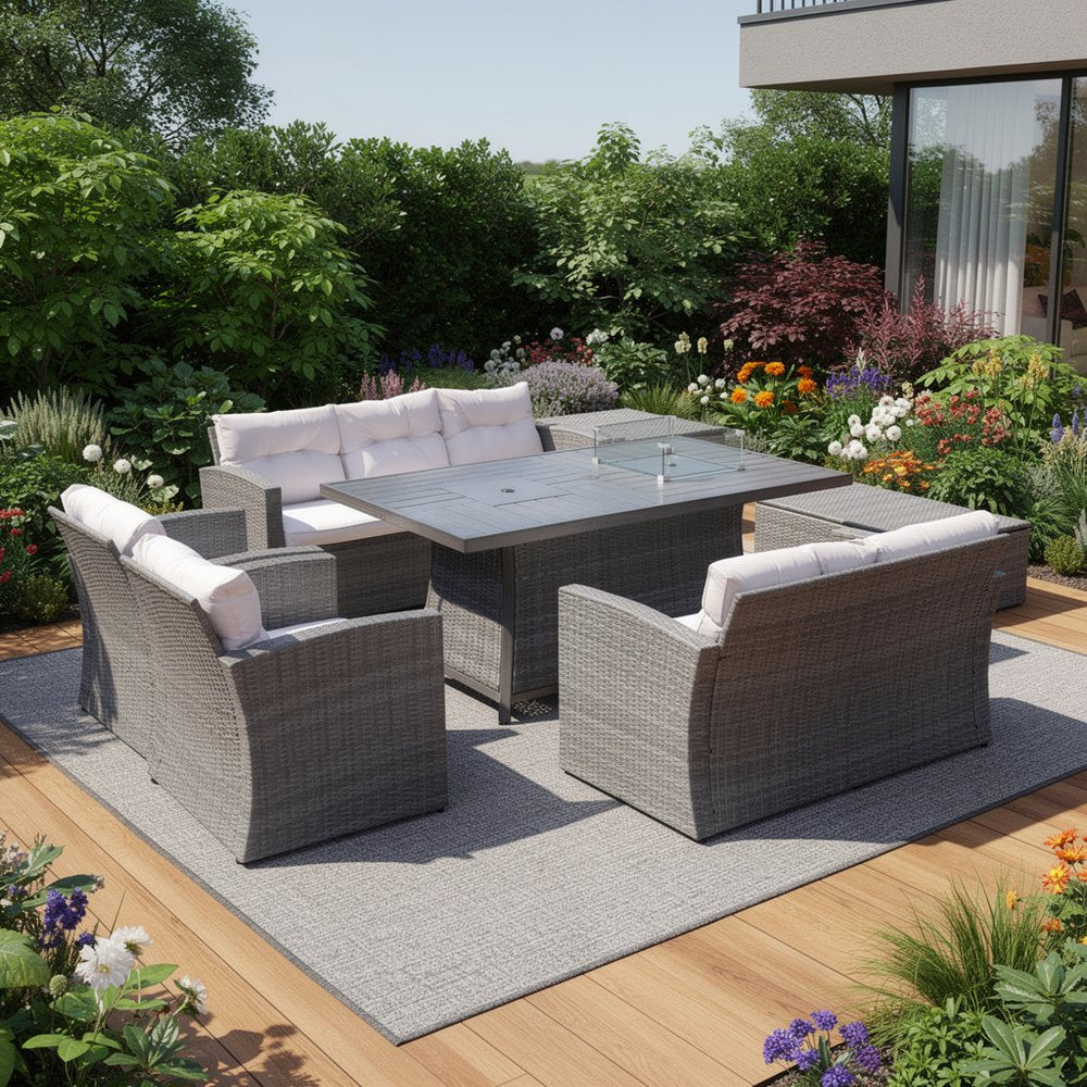 Seven Piece Gray Wicker Upholstered Cushions Sectional Seating Group with Fire Pit and Table