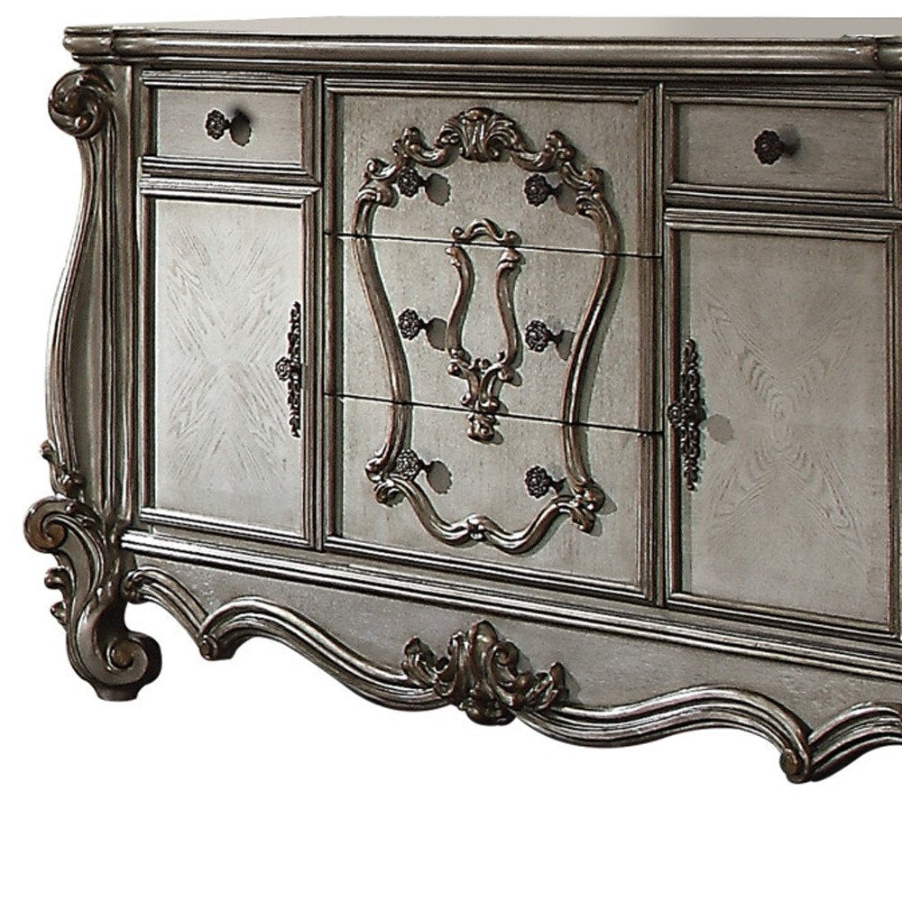 Platinum Carved Scrollwork Wood and Polyresin Five Drawer Triple Dresser