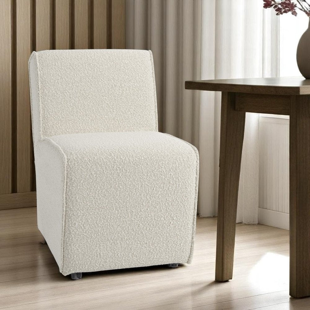 Set of Two Cream Boucle Swivel Dining Side Chairs with Wheels