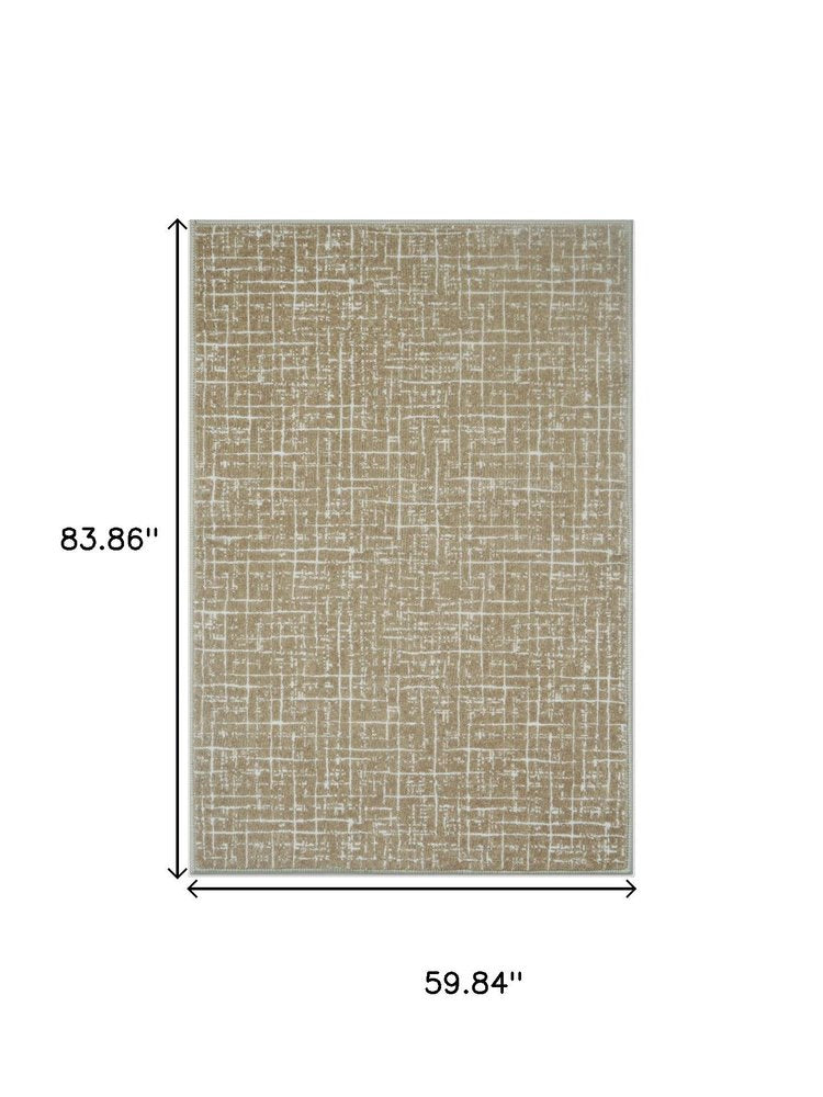 5' X 7' Gold and Ivory Abstract Geometric Distressed Washable Area Rug