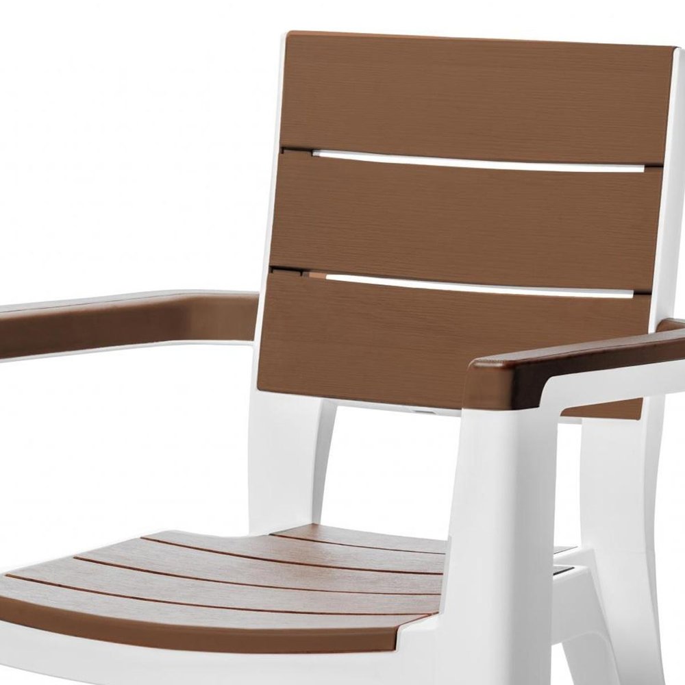 Nine Piece Brown Plastic Outdoor Patio Set with Table